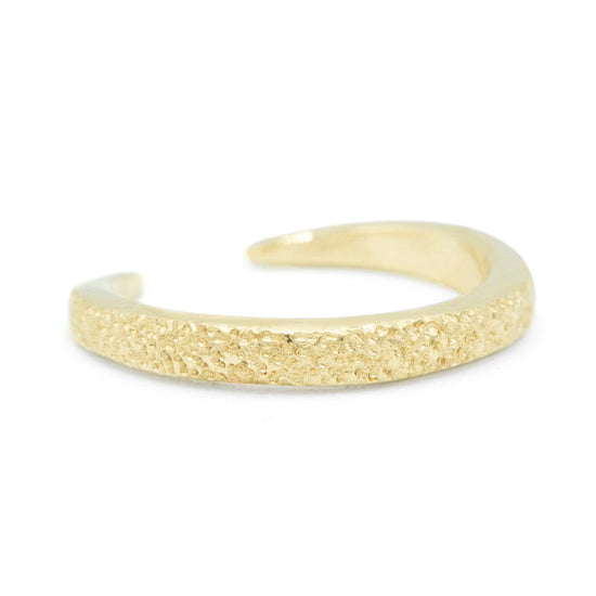 Horseshoe Band in 14k yellow gold with signature sand texture by Erin Cuff Jewelry.